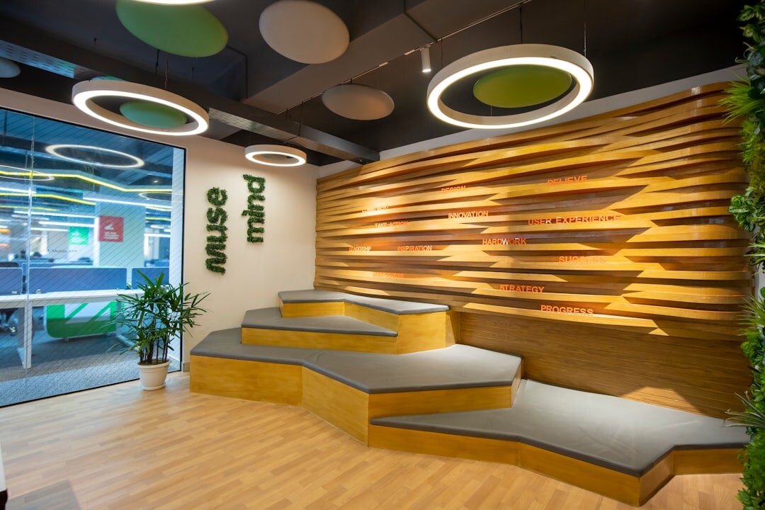 Modern bright office reception area with seating