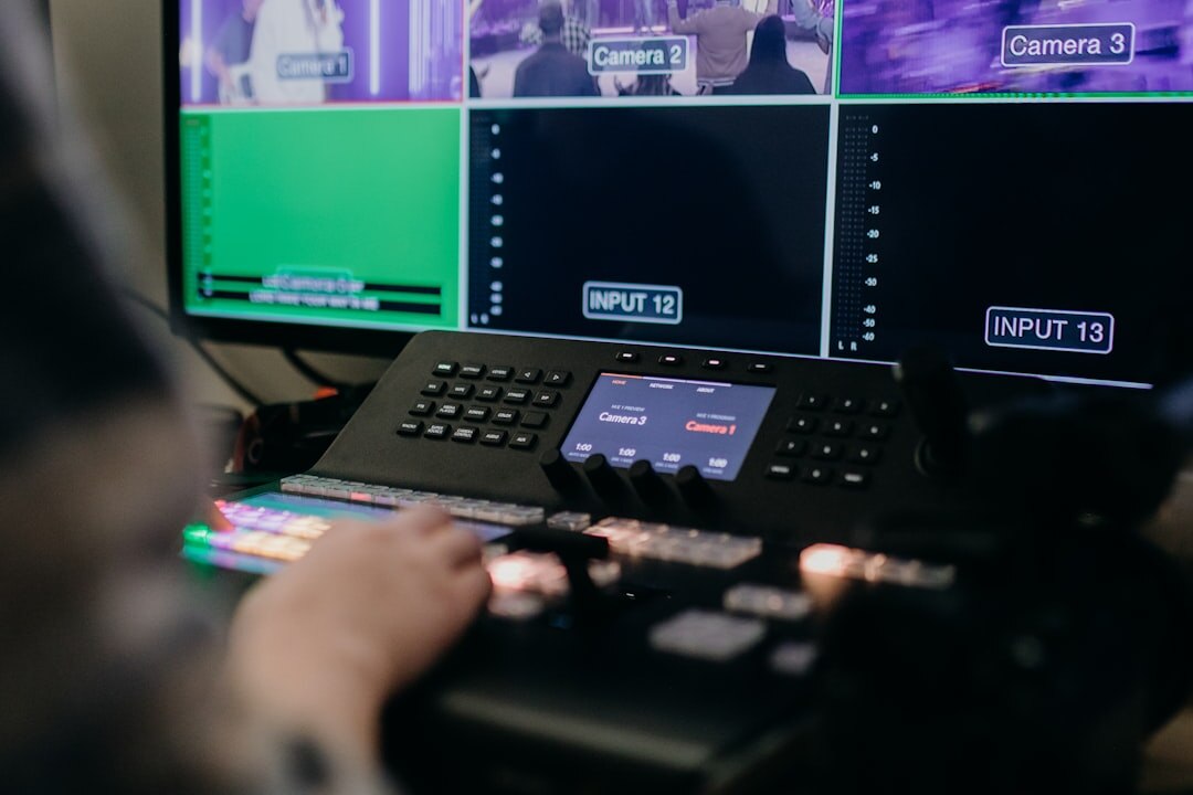 Broadcast control room with multiple screens showing live feeds